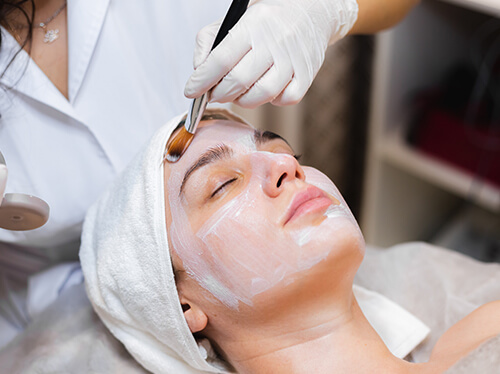 women with facial treatment cream for face rejuvenation