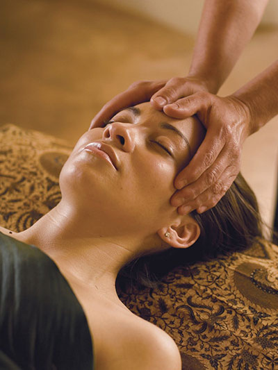 a women having head massage